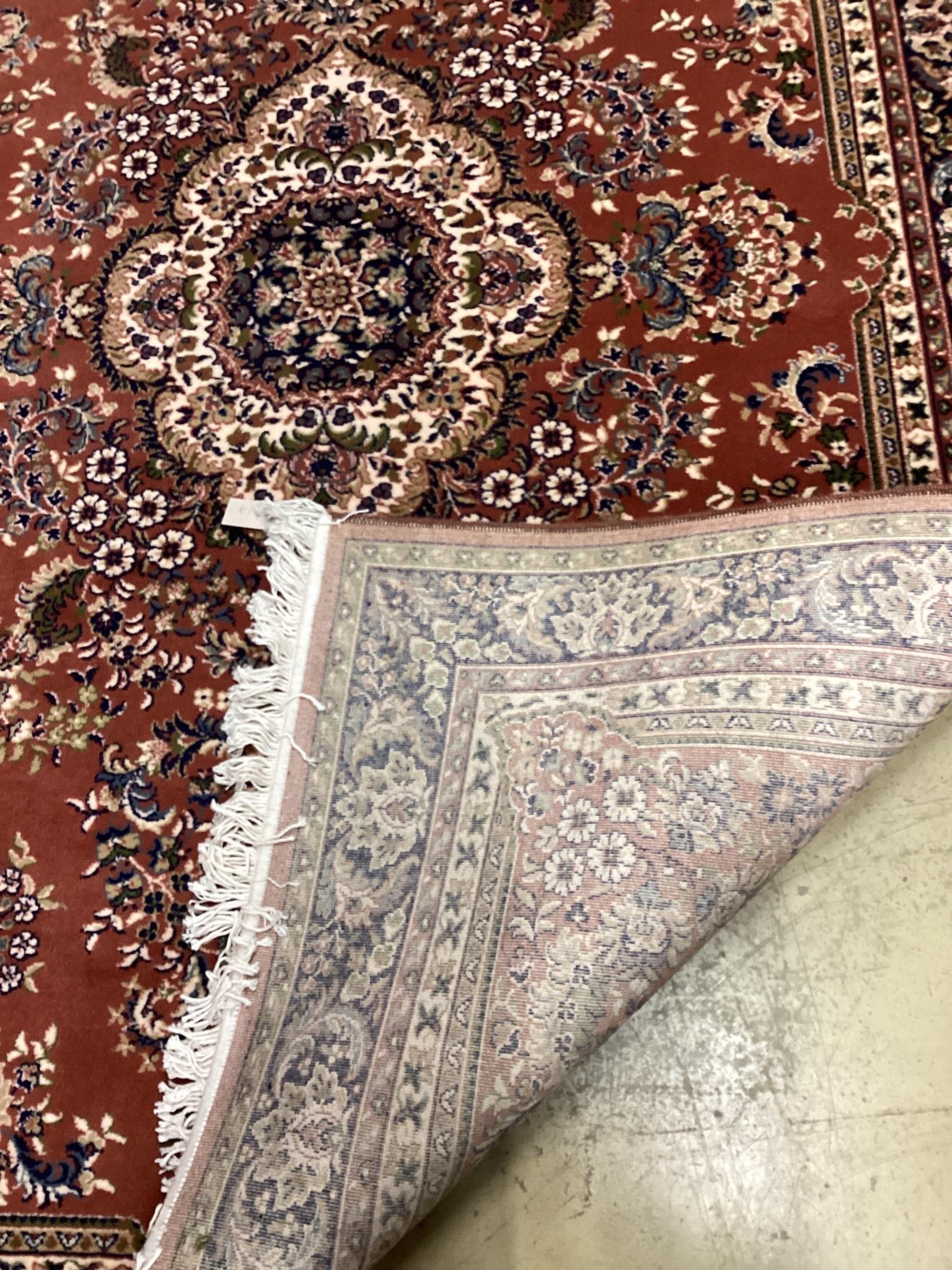 A modern Tabriz style red ground rug, 240 x 162cm